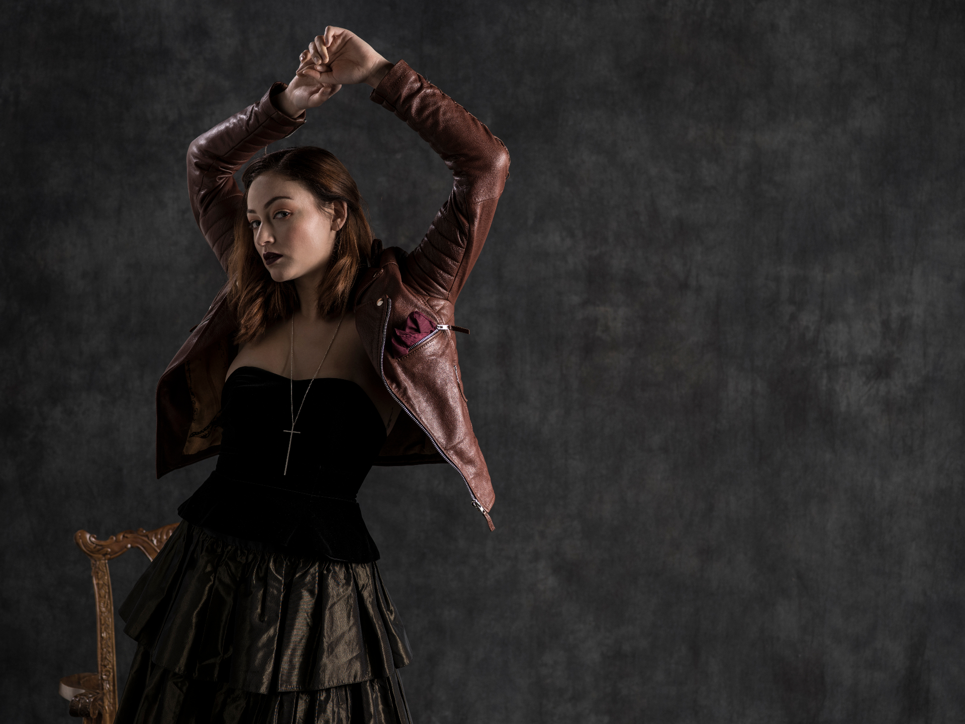 Eternity jacket worn — oxblood, arms raised, butterfly lining visible